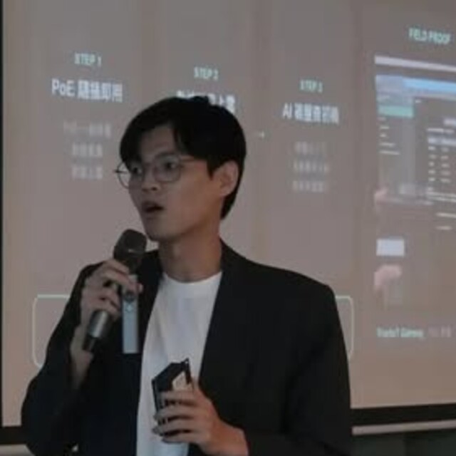 Hengjun Lu speaking at a presentation